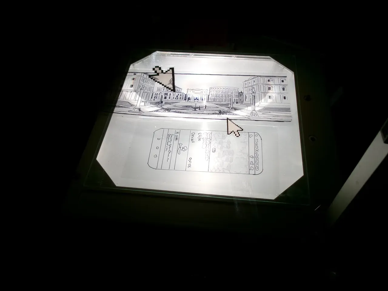 Transparent paper on a light desk with the drawing of a landscape and a smartphone UI